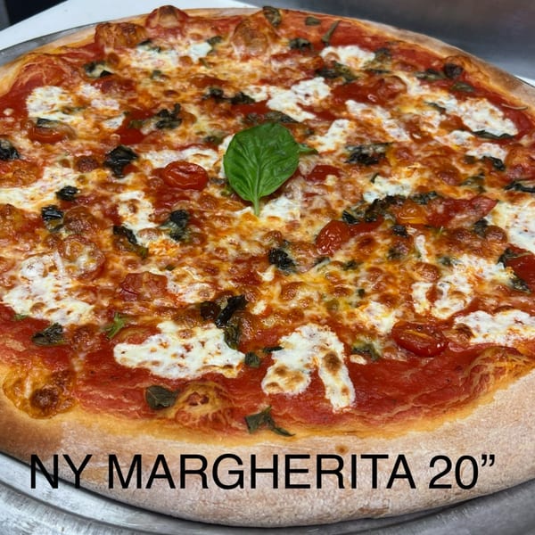 A large, round Angolino Pizza Margherita with melted cheese, tomato sauce, and fresh basil.
